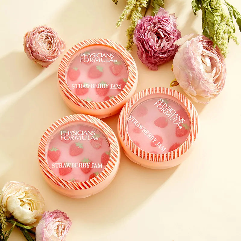 Physicians Formula Strawberry Jam blush compacts with strawberry pattern and surrounded by flowers