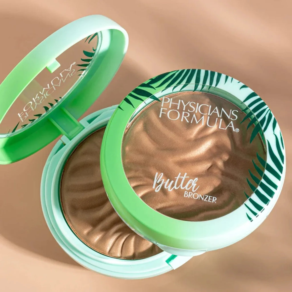 Physicians Formula Butter Bronzer compact in tropical packaging with open and closed views on a neutral background