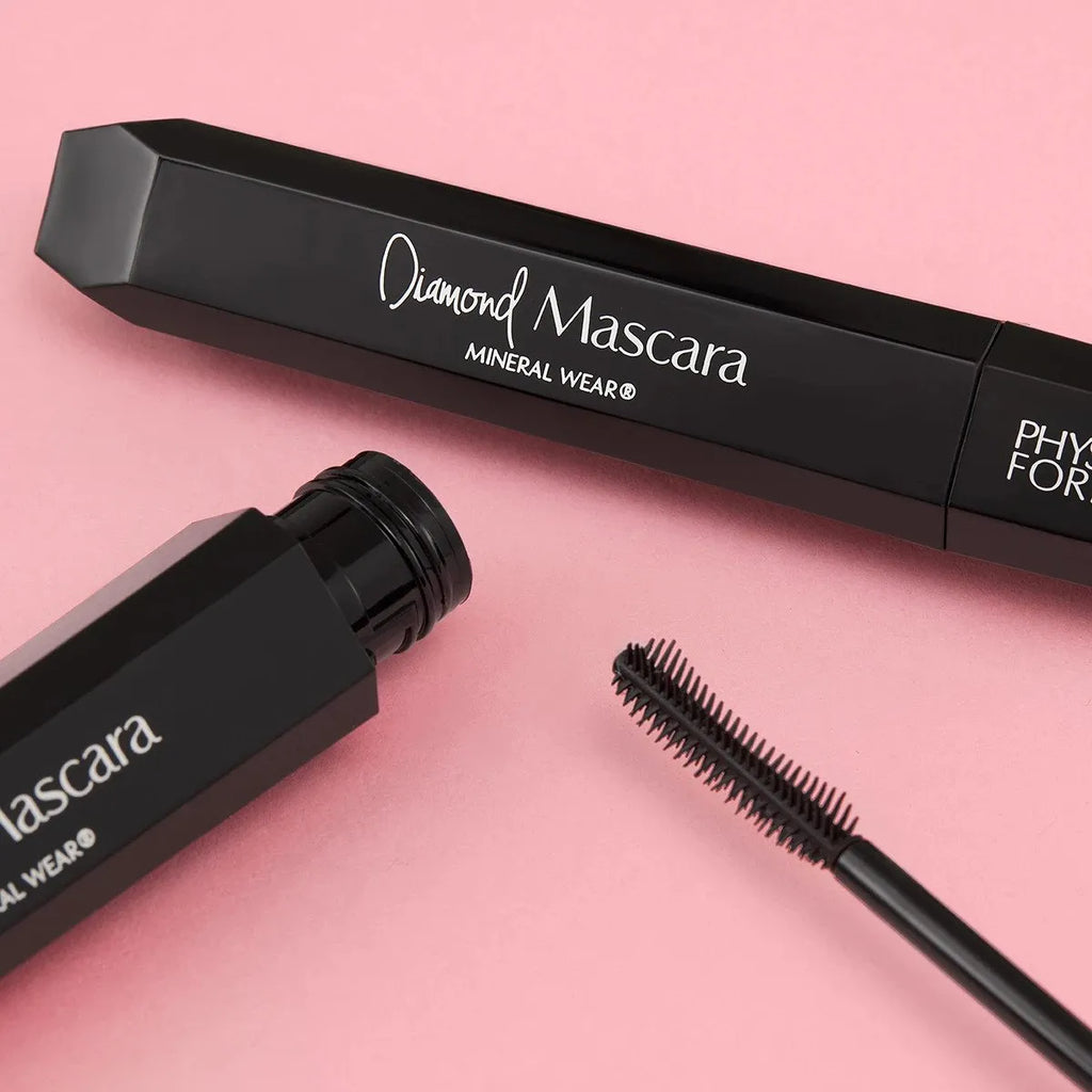 Physicians Formula Diamond Mascara in black tube on pink background