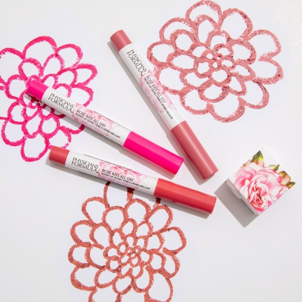 Rose Kiss All Day Lip Kit Set products laid out on floral and white background