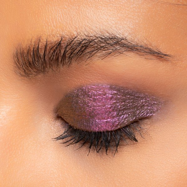 Mineral Wear Diamond Melt-allic Model, closeup of eyeshadow on the lid in shade Precious Purple