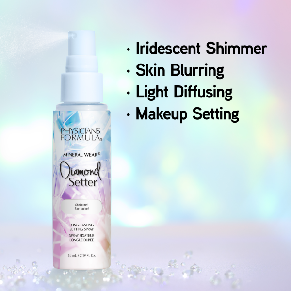 1712798 Mineral Wear Diamond Setter | front product view of bottle spraying with iridescent, diamond backdrop | image text: Iridescent Shimmer, Skin Blurring, Light Diffusing, Makeup Setting