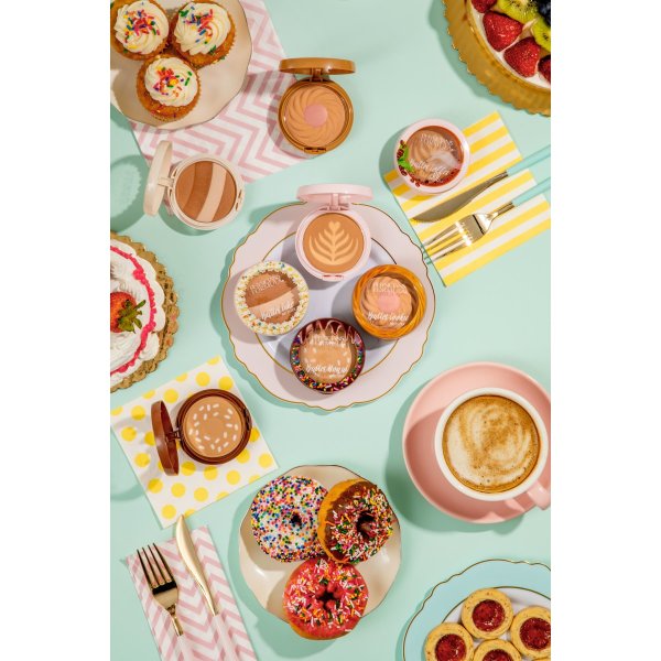 Butter Cheat Day Full Collection on light blue background surrounded by desserts