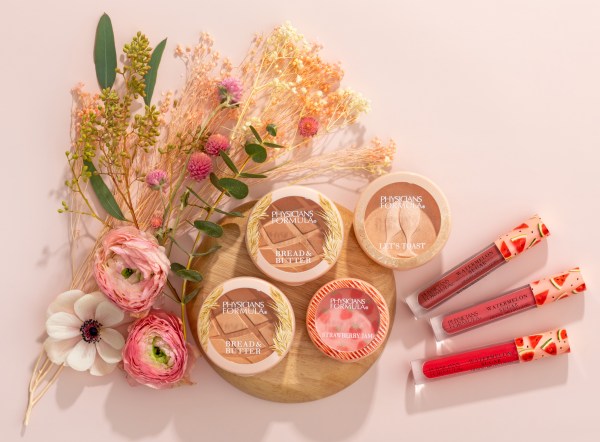 Bread & Butter Full Collection Butter Bronzers, Strawberry Jam Blush, Watermelon Sugar Lipglosses with flowers and pale pink background