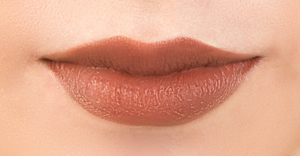 Organic Wear Nourishing Lipstick Model, closeup on lips in shade Buttercup