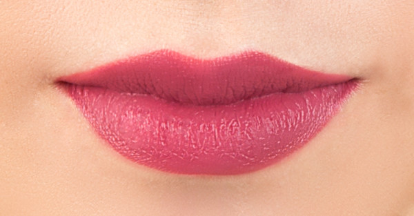 Organic Wear Nourishing Lipstick Model, closeup of lips in shade Raspberry Crush