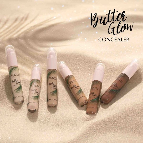 1712793, 1712794, 1740870, 1740871, 1712792, 1740872 Butter Glow Concealer | all shades of concealer on tan sand with palm shadow